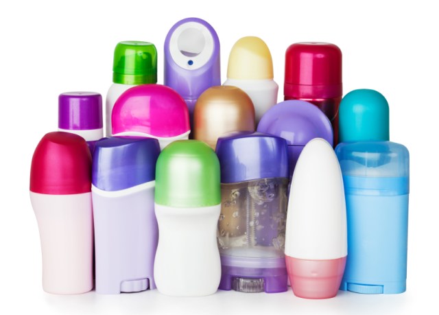Plastic cosmetics bottles on white background